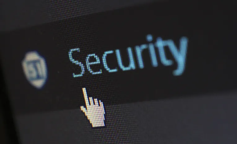 Mouse cursor over digital security text on a screen, illustrating browser extension safety checks