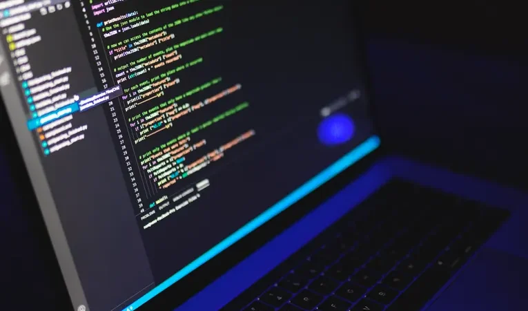 Colourful code displayed on a laptop screen, illustrating the Fal AI developer inference platform review