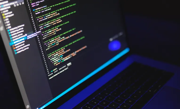 Colourful code displayed on a laptop screen, illustrating the Fal AI developer inference platform review