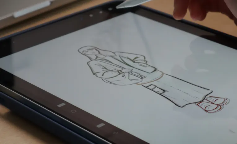 Hand using a stylus to sketch on a digital tablet, illustrating the Krea AI real-time image generation review
