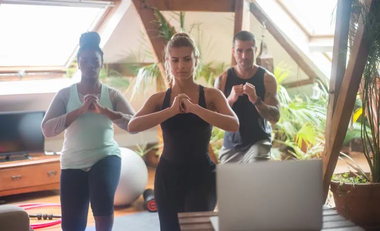 People practicing a guided home workout session, illustrating the MAGIC AI smart fitness mirror review