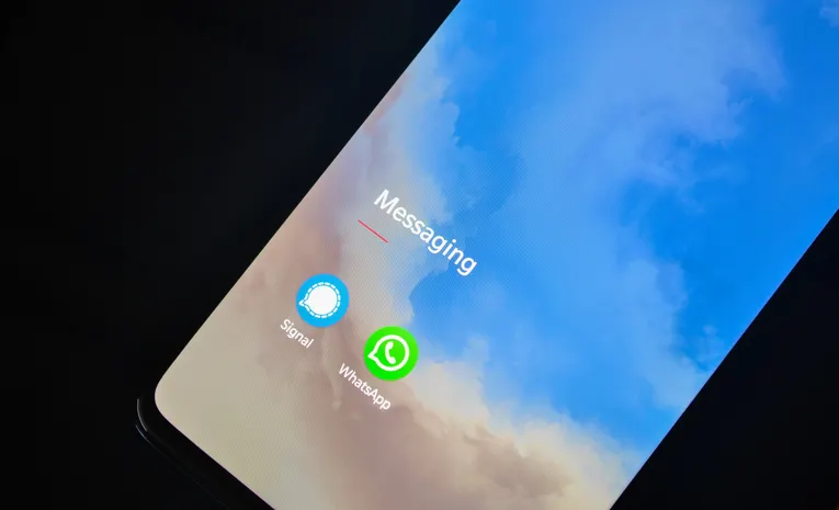 Smartphone screen showing multiple messaging apps, illustrating the Poe multi-model AI chat review
