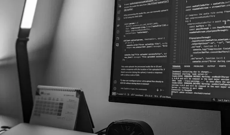 Software developer working with code on a monitor, illustrating the Replit Agent review