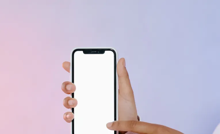 Person touching a mobile phone screen, illustrating the Rork AI mobile app builder review