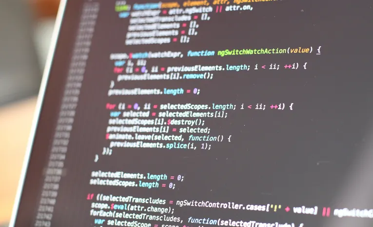 Dark terminal screen displaying code, illustrating the Warp AI terminal review