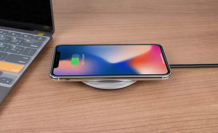Smartphone charging close-up, illustrating public USB charging port safety and juice jacking risks