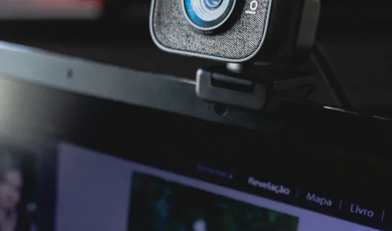 Webcam mounted on a laptop display, illustrating signs of a hacked webcam