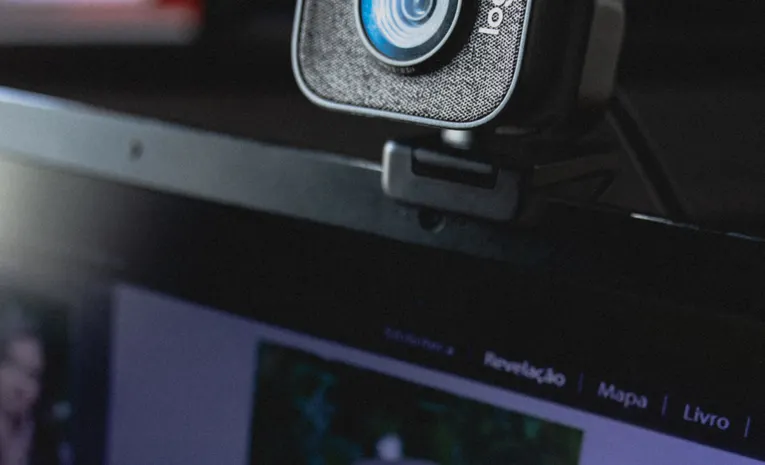 Webcam mounted on a laptop display, illustrating signs of a hacked webcam